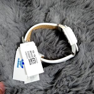 White addidas watch.